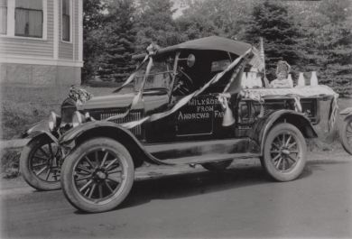 Frank Andrews Jr in Bar Harbor parade with milk delivery truck