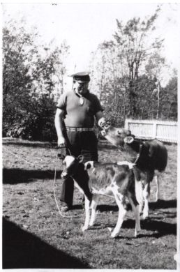 O.J. Clark with cows (photo 2 of 2)