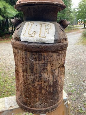 A milk can found in Lloyd's dump on his Trenton Farm. When full, the can would have weighed 88 lbs (80# milk + the 8# can).